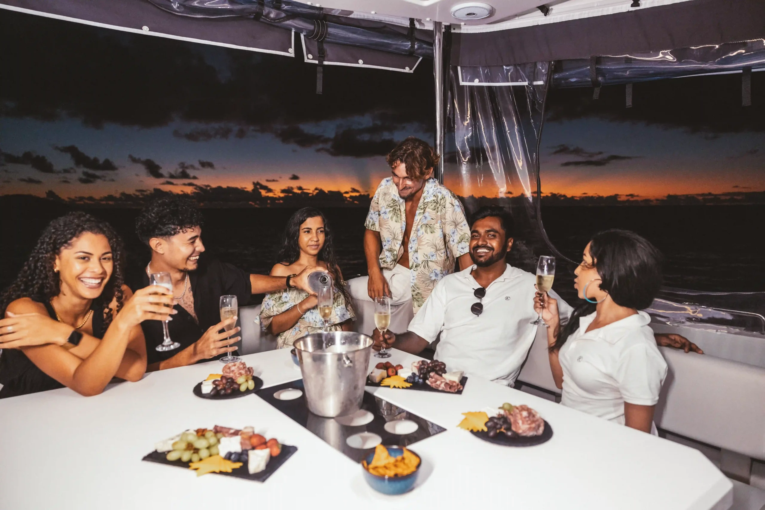 friends-dining-on-yacht-during-sunset-cruise
