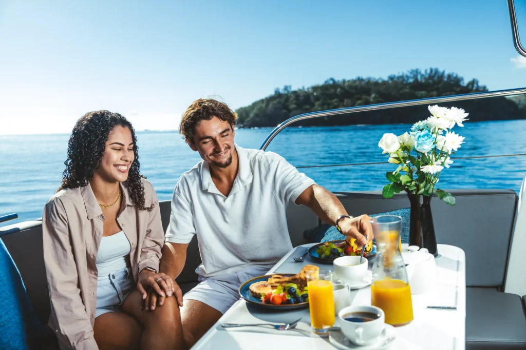 two peoples enjoying on yatch