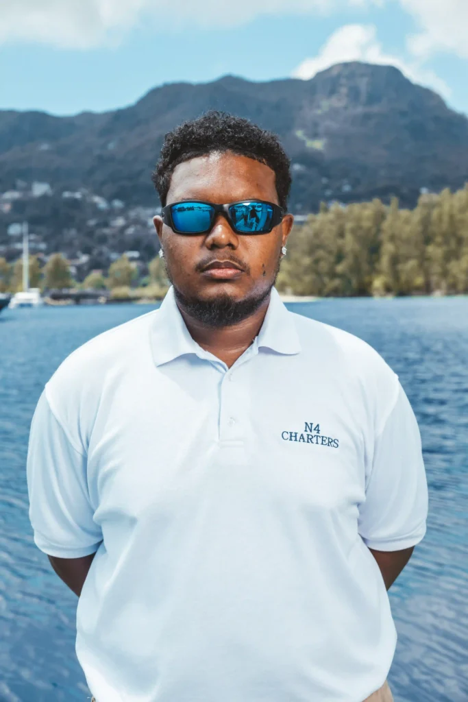 yacht-crew-member-portrait-ocean-background